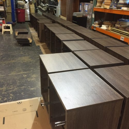 A group of cabinets that are sitting on the floor.