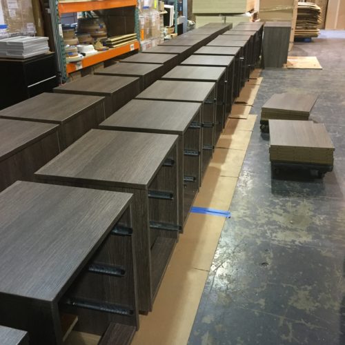 A large amount of drawers are lined up in the warehouse.