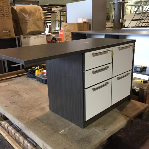 A counter with drawers and a table top