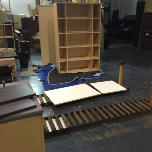 A table that is being assembled in an office.